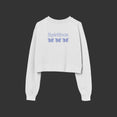 White cropped crewneck sweatshirt against a white background. The cropped crewneck says 